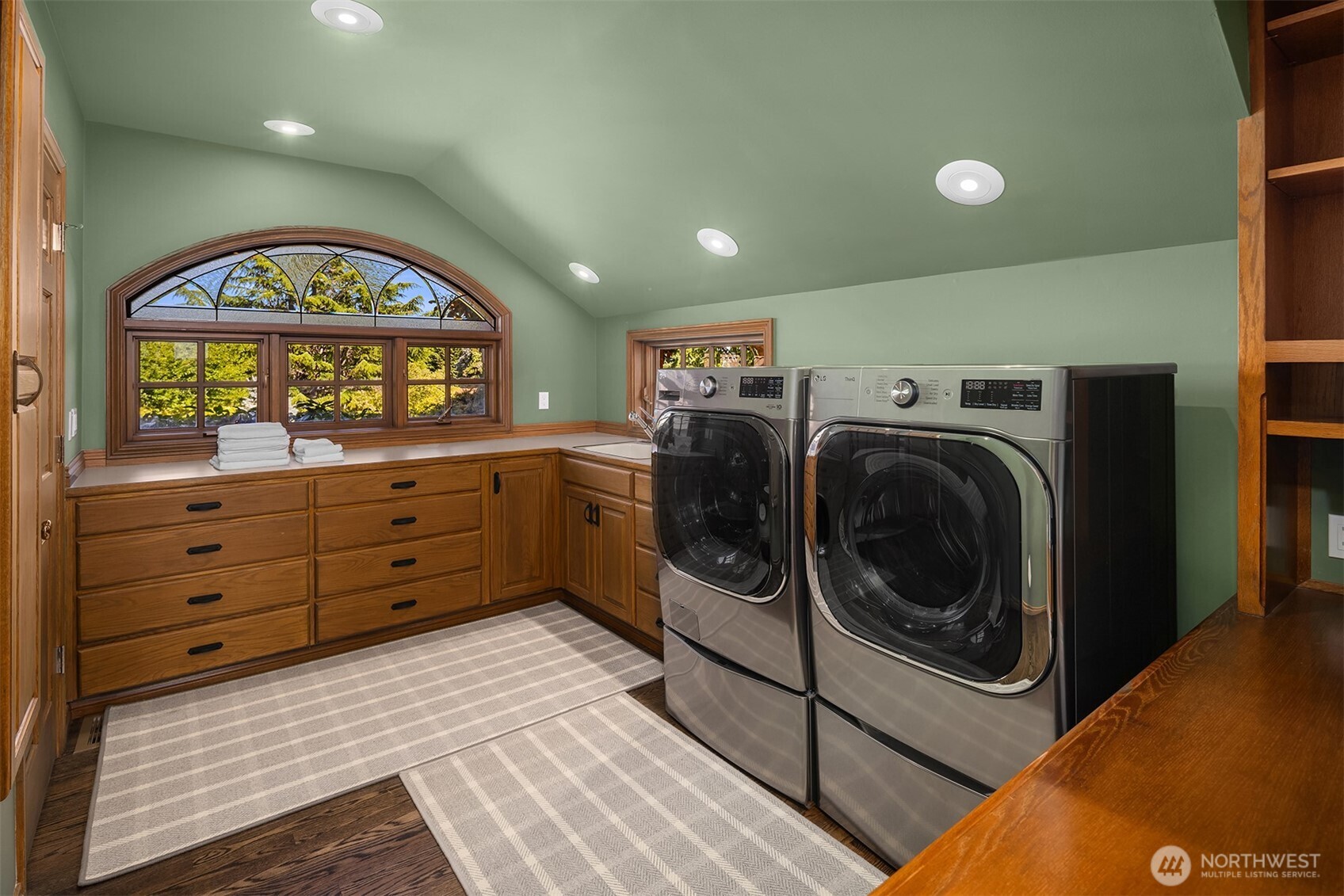 2307 Evergreen Point Road Medina, WA 98039 - Photo 22 of 40 a view of a hallway with washer and dryer
