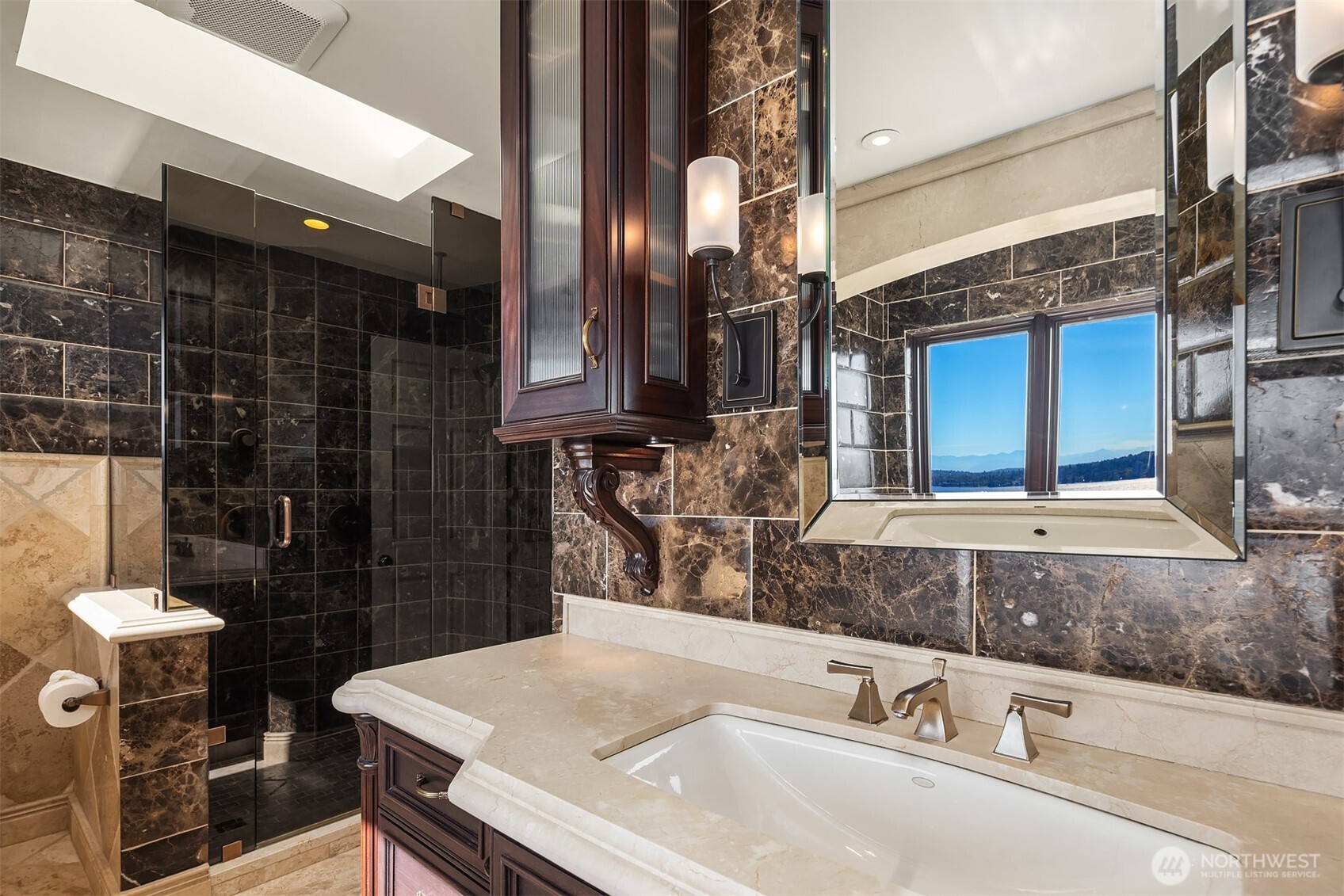 2307 Evergreen Point Road Medina, WA 98039 - Photo 28 of 40 a bathroom with a sink a toilet and shower