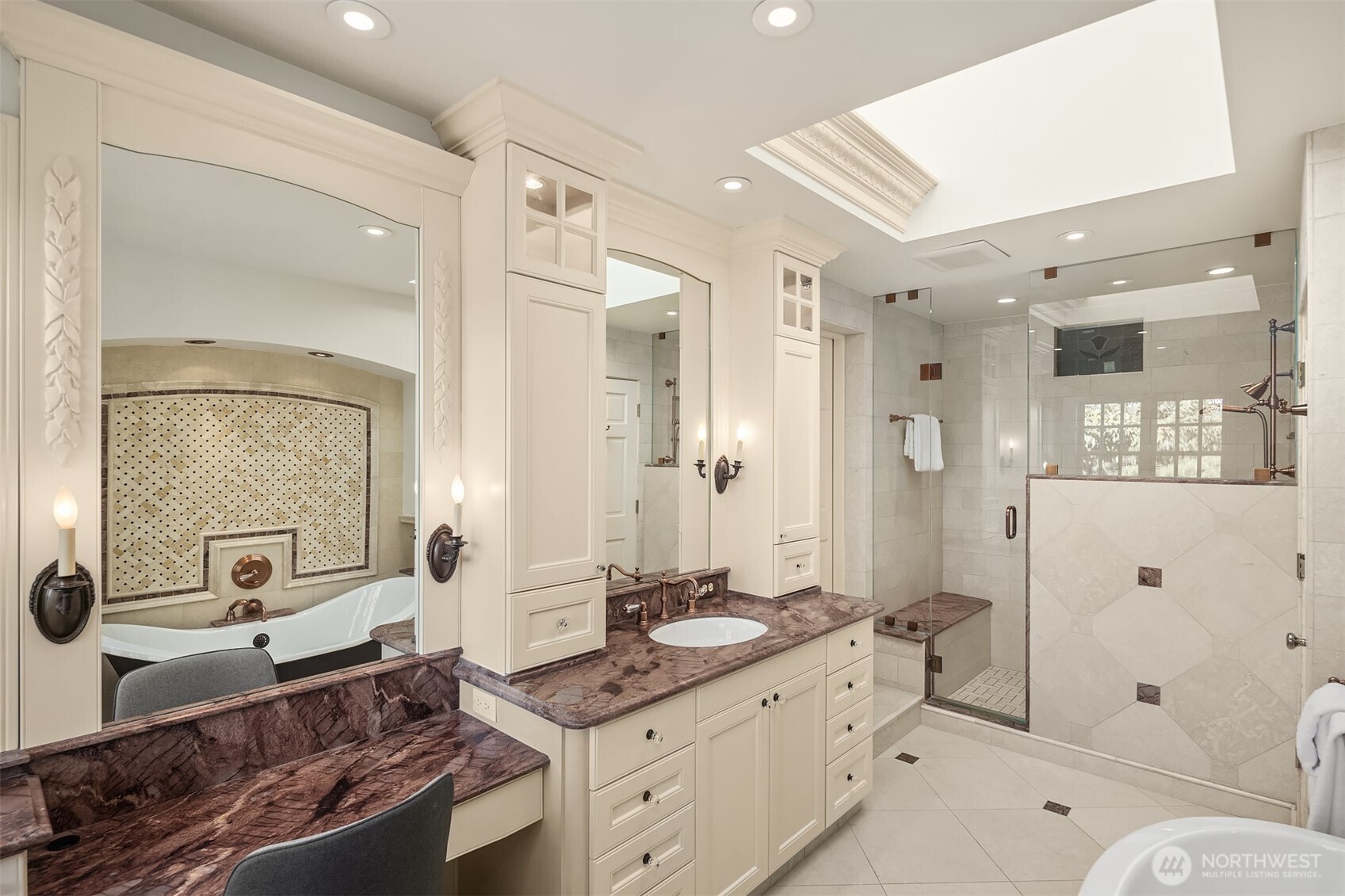 2307 Evergreen Point Road Medina, WA 98039 - Photo 29 of 40 a spacious bathroom with a granite countertop sink a toilet a mirror and shower