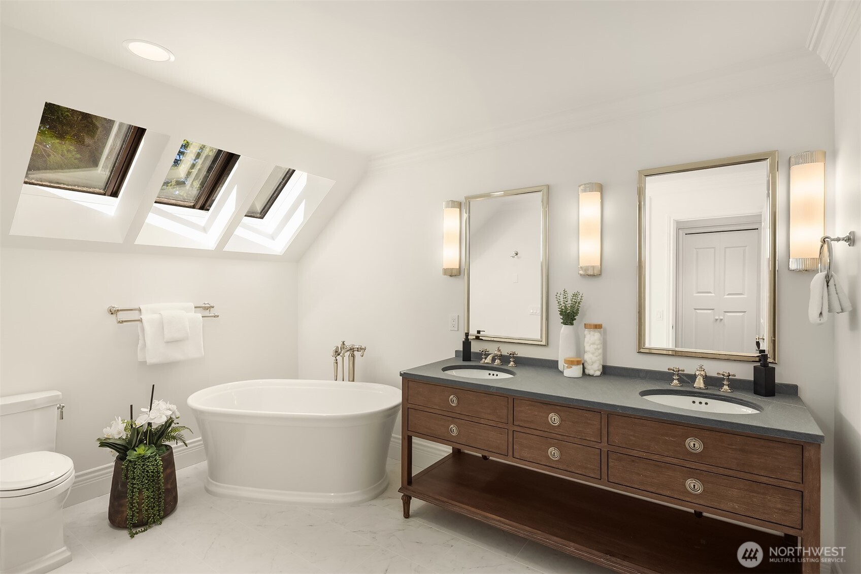 2307 Evergreen Point Road Medina, WA 98039 - Photo 32 of 40 a bathroom with a double vanity sink and a mirror