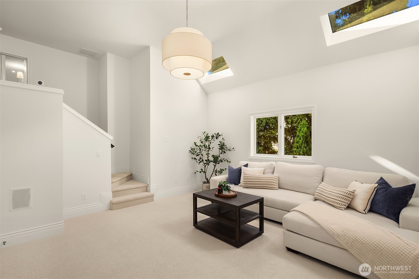 2307 Evergreen Point Road Medina, WA 98039 - Photo 34 of 40 a living room with furniture flowerpot and a chandelier