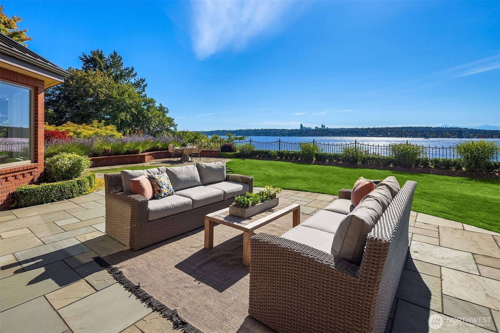 2307 Evergreen Point Road Medina, WA 98039 - Photo 38 of 40 a view of a patio with couches under an umbrella