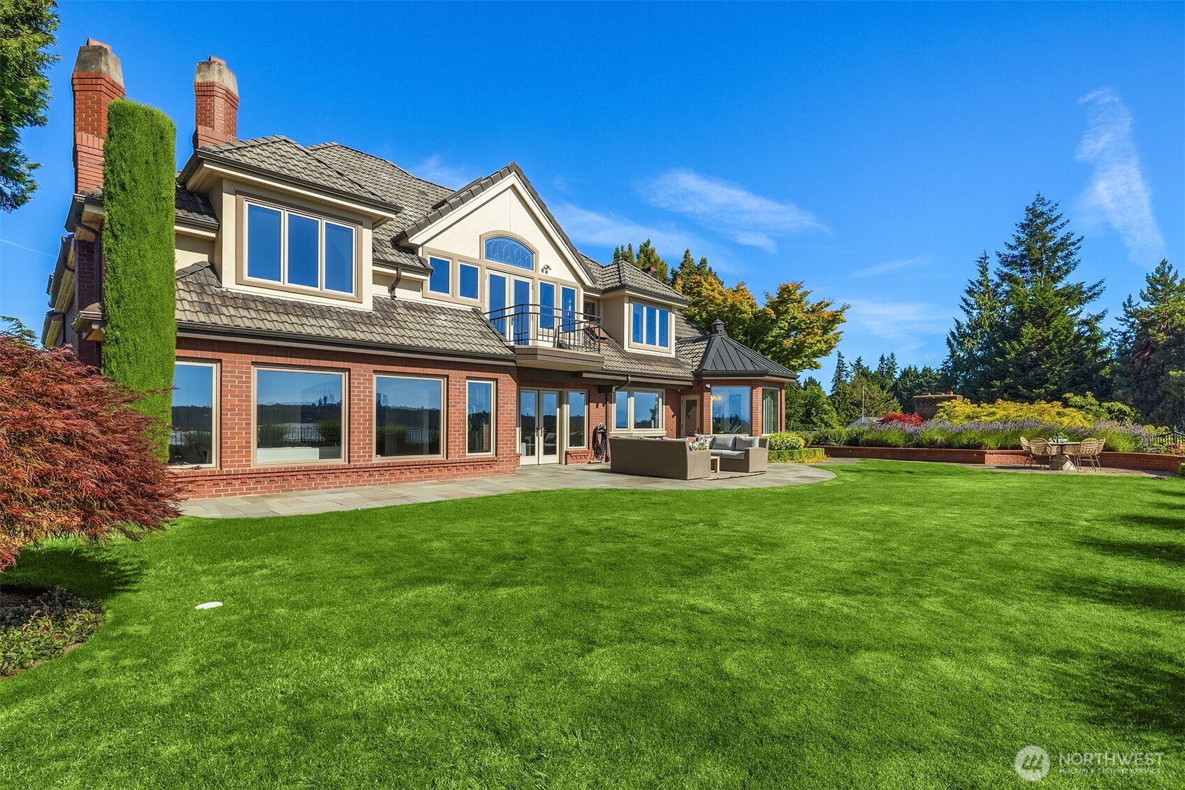 2307 Evergreen Point Road Medina, WA 98039 - Photo 4 of 40 a view of a house with a yard table and chairs