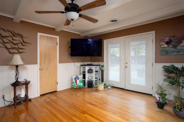 a view of livingroom with furniture and a flat screen tv