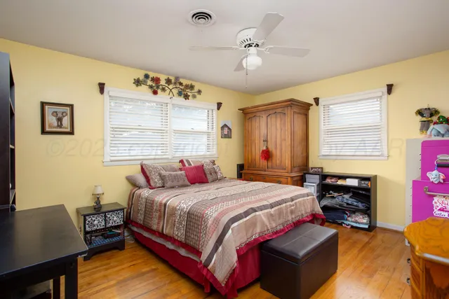 a bedroom with a bed and chair