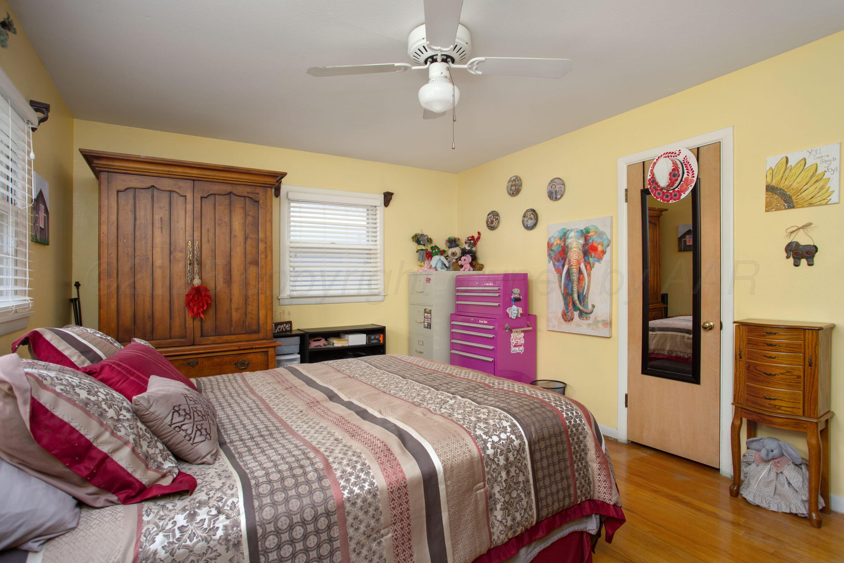 3600 Patterson Drive Amarillo, TX 79109 - Photo 20 of 31 a bedroom with a bed dresser and window