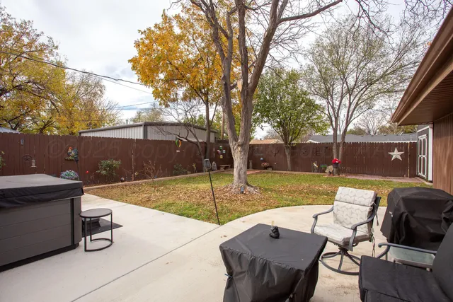 a view of backyard with outdoor seating