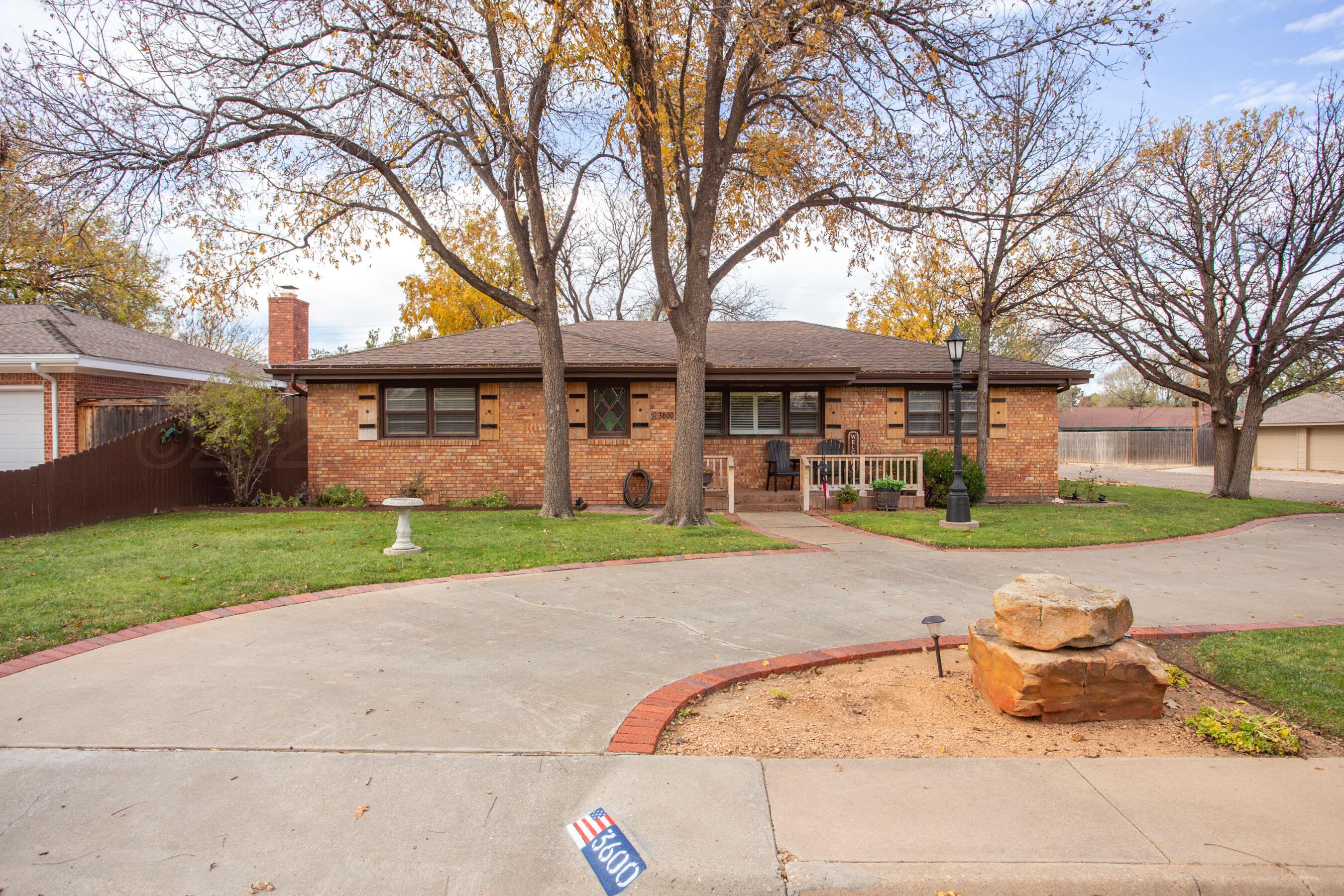 3600 Patterson Drive Amarillo, TX 79109 - Photo 3 of 31 a front view of a house with a yard and garage