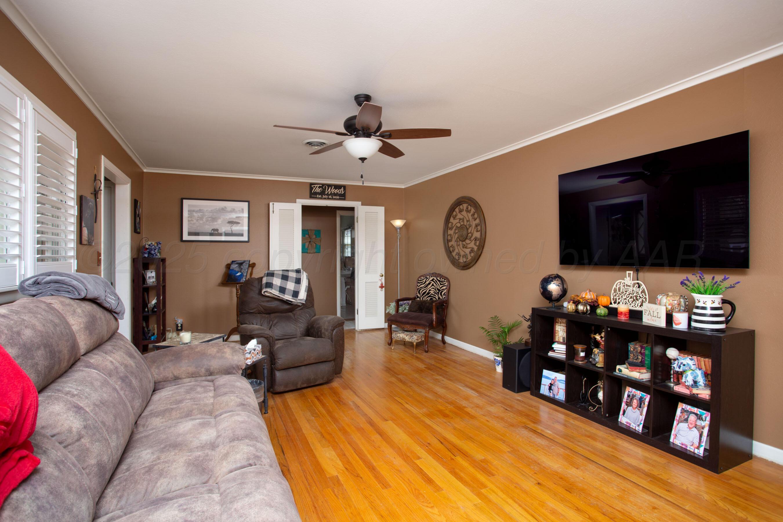 3600 Patterson Drive Amarillo, TX 79109 - Photo 6 of 31 a living room with furniture and a flat screen tv