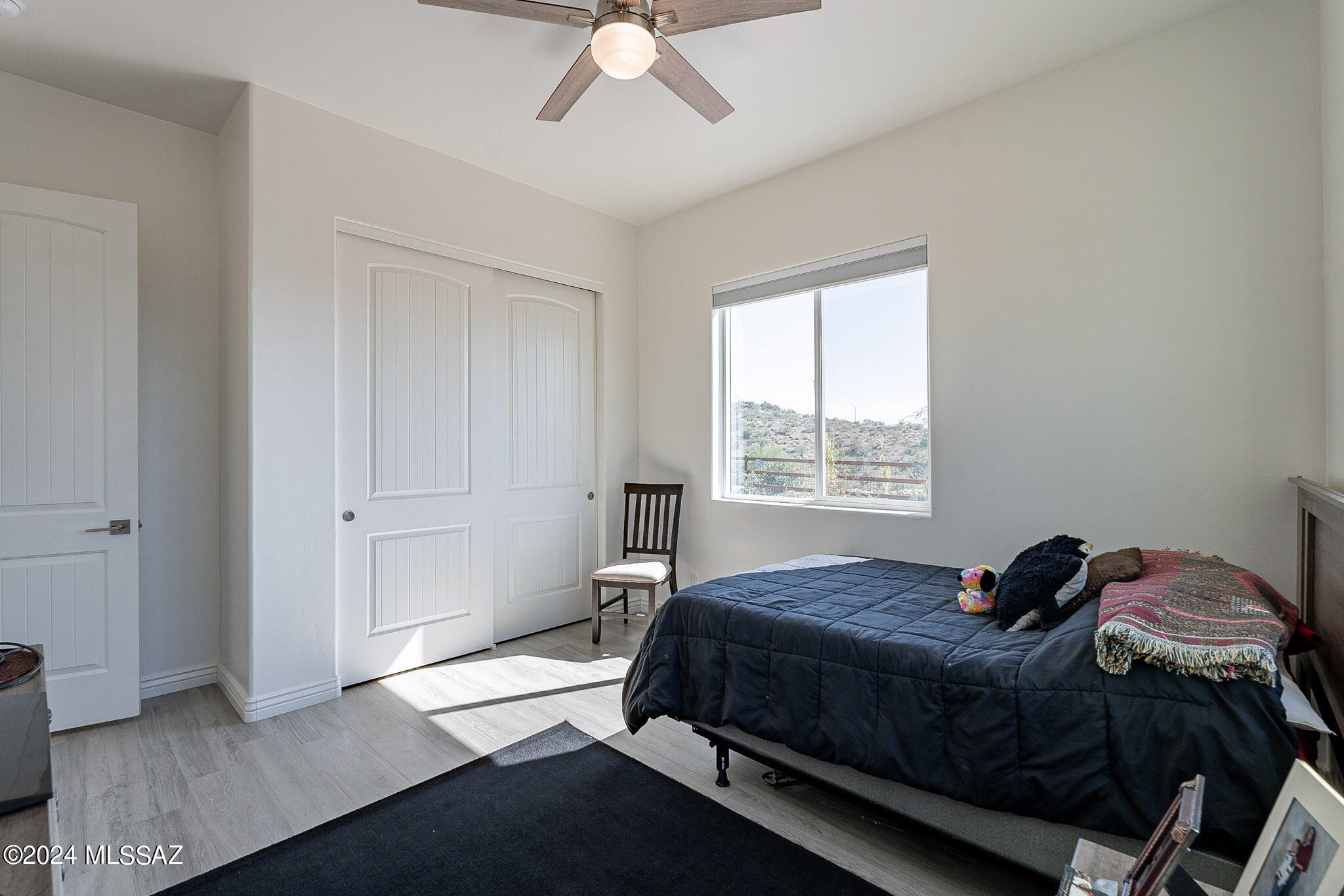 176 Avenida Ostion Rio Rico, AZ 85648 - Photo 31 of 48 a bedroom with a bed and a window