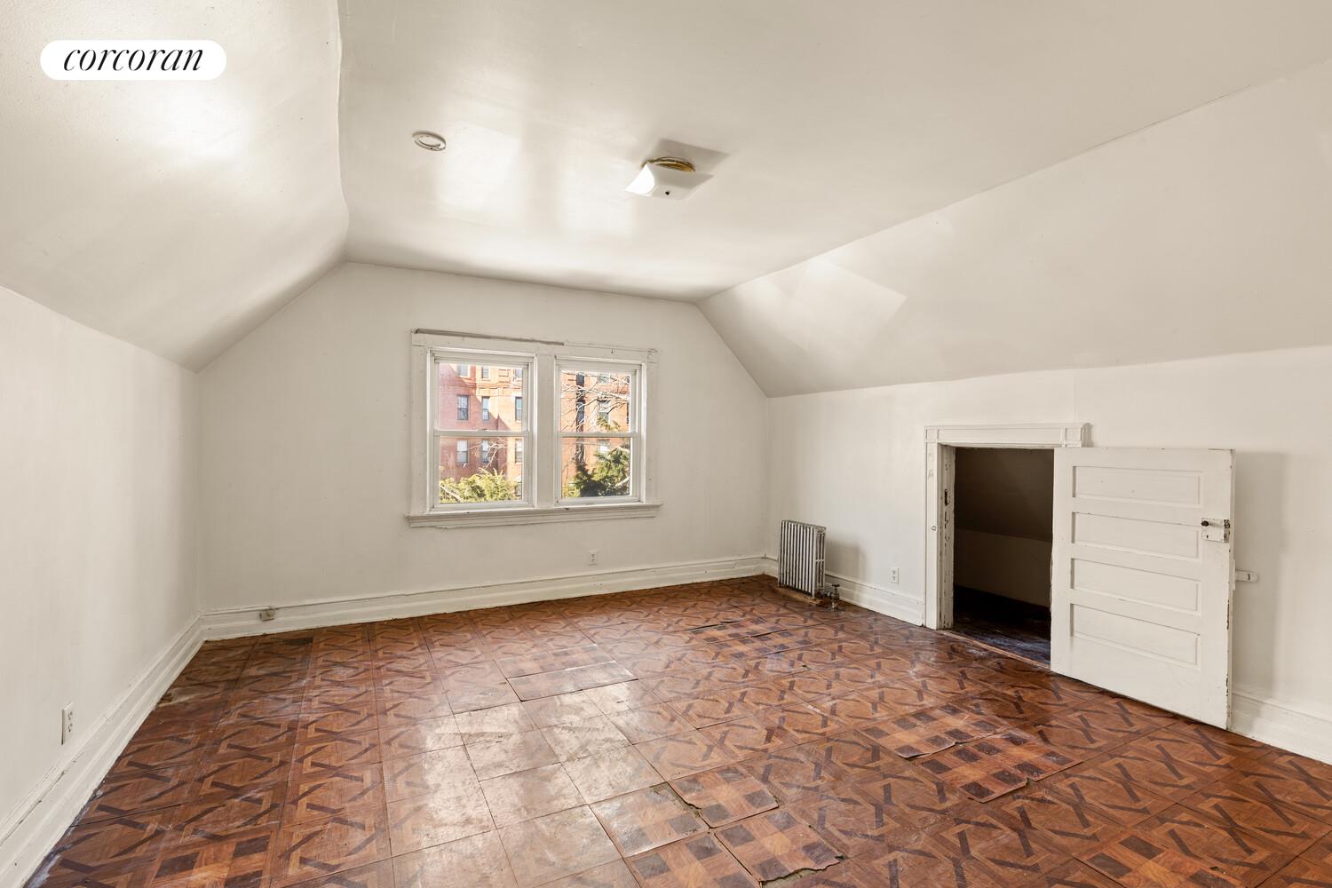 86 Lincoln Road Brooklyn, NY 11225 - Photo 10 of 12 a view of an empty room with a window