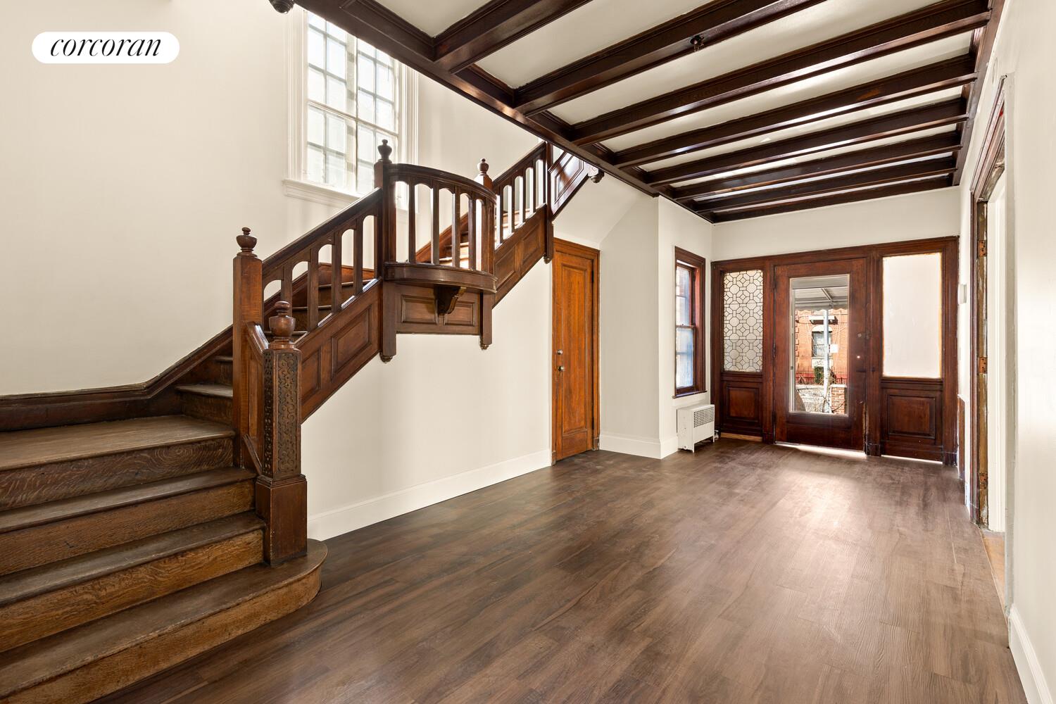 86 Lincoln Road Brooklyn, NY 11225 - Photo 2 of 12 a view of an entryway with wooden floor
