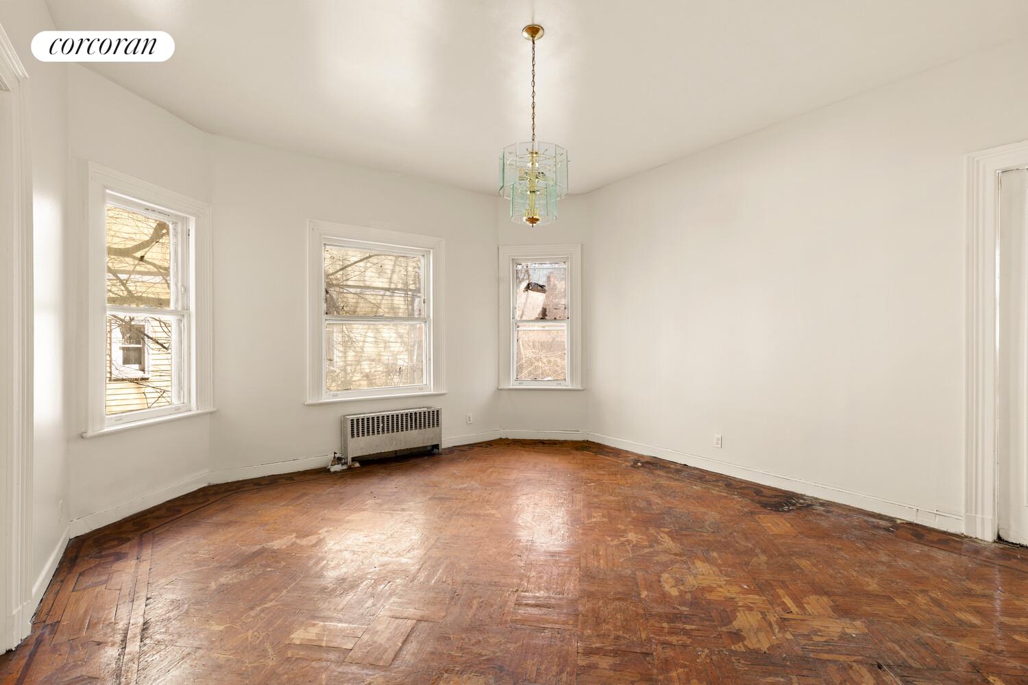 86 Lincoln Road Brooklyn, NY 11225 - Photo 5 of 12 a view of an empty room with a window