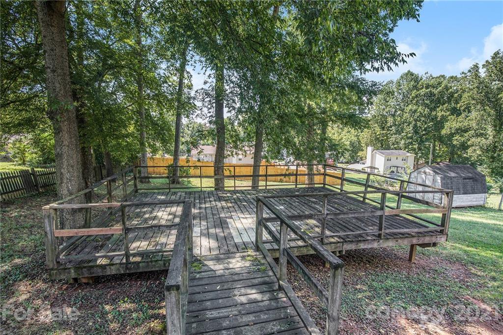 5625 Beaconsfield Road Charlotte, NC 28214 - Photo 12 of 21 a view of a park with large trees