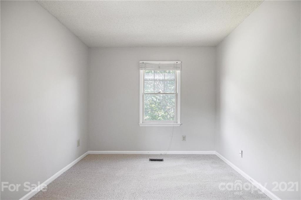 5625 Beaconsfield Road Charlotte, NC 28214 - Photo 19 of 21 an empty room with a window