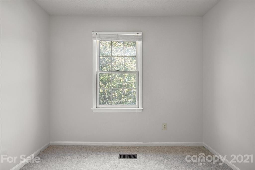 5625 Beaconsfield Road Charlotte, NC 28214 - Photo 20 of 21 an empty room with a window