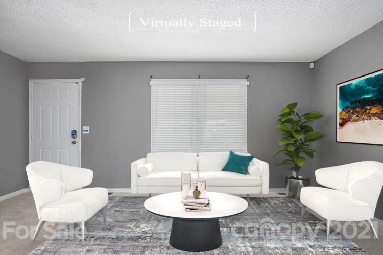5625 Beaconsfield Road Charlotte, NC 28214 - Photo 2 of 21 a living room with furniture and a potted plant