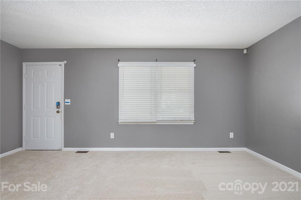5625 Beaconsfield Road Charlotte, NC 28214 - Photo 8 of 21 an empty room with a window