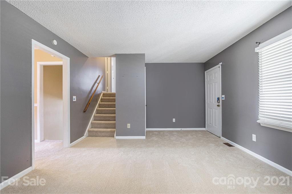 5625 Beaconsfield Road Charlotte, NC 28214 - Photo 9 of 21 a view of an empty room with stairs