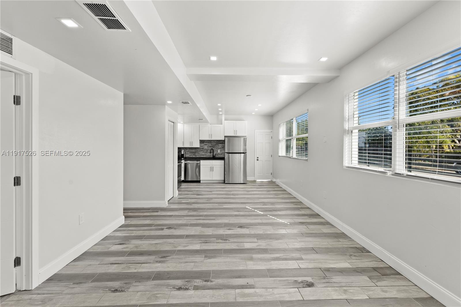 305 Northwest 58th Street Miami, FL 33127 - Photo 14 of 20 a view of kitchen and windows