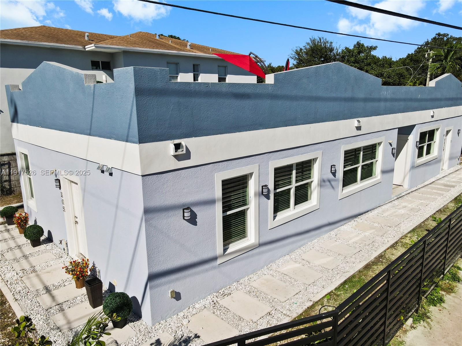 305 Northwest 58th Street Miami, FL 33127 - Photo 10 of 20 a view of a house with a deck