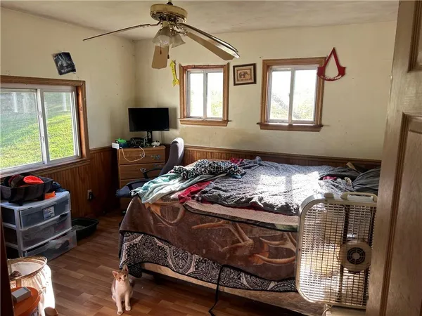 a bedroom with a bed and window