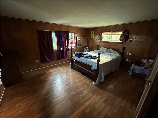 a room with bed and window