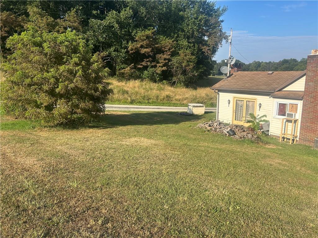 65 Sandrock Road Vanderbilt, PA 15486 - Photo 28 of 30 a view of yard and swimming pool with green space