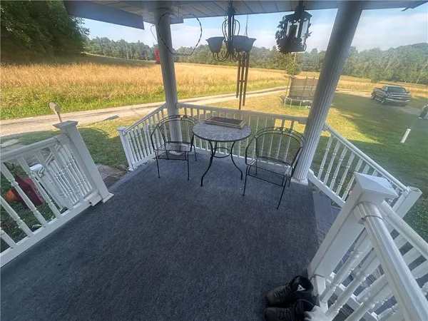 a view of a balcony with an ocean view
