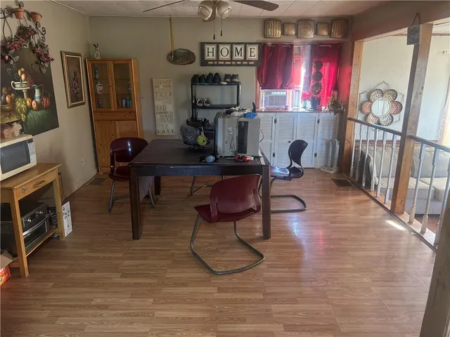 a work room with furniture a rug and a fireplace