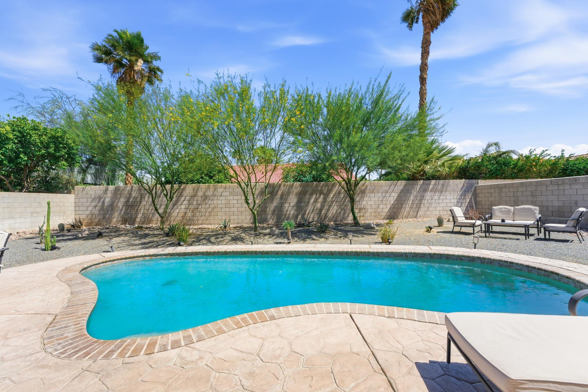 67220 Quijo Road Cathedral City, CA 92234 - Photo 26 of 26 a view of a swimming pool with a patio