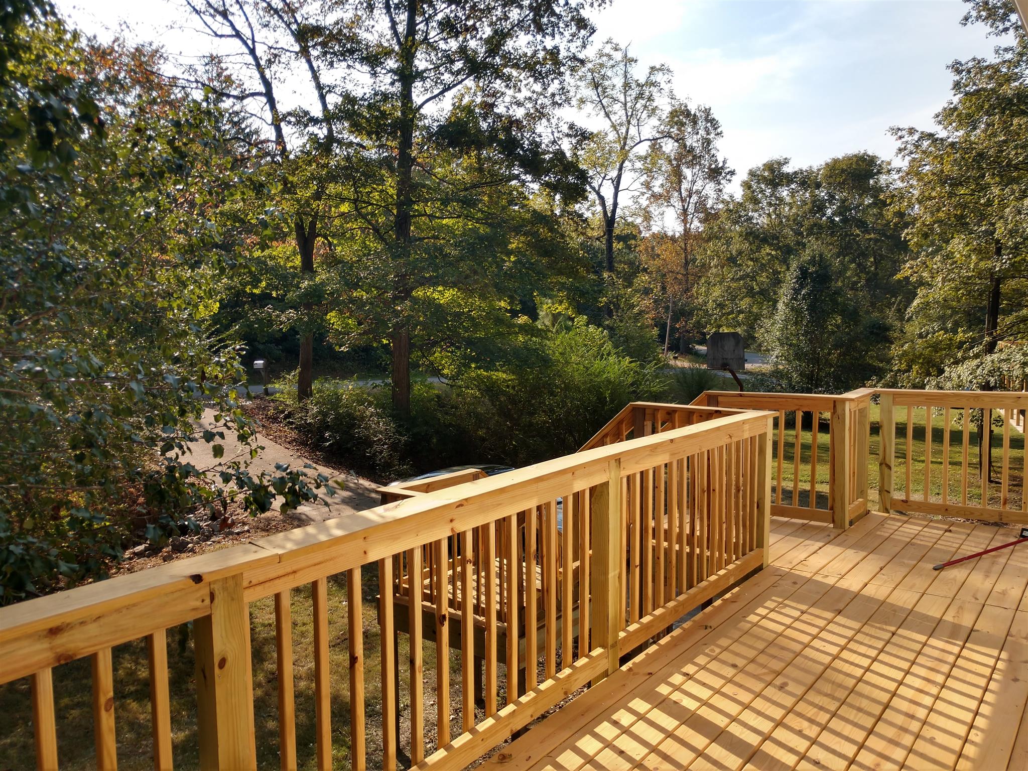 336 Harper Road Clarksville, TN 37043 - Photo 8 of 20 a balcony with wooden floor and yard