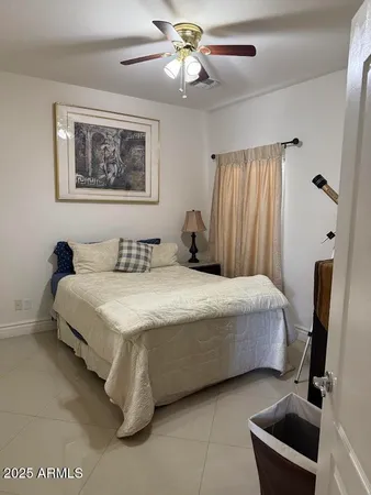 a room with a bed and television