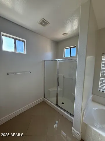 a room with two sink and cabinets