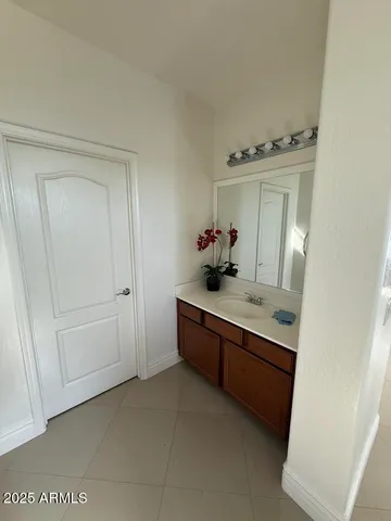 a bathroom with a toilet and a mirror