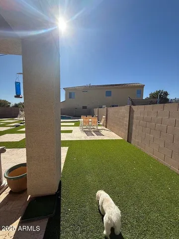 a view of a swimming pool with an outdoor space and seating area