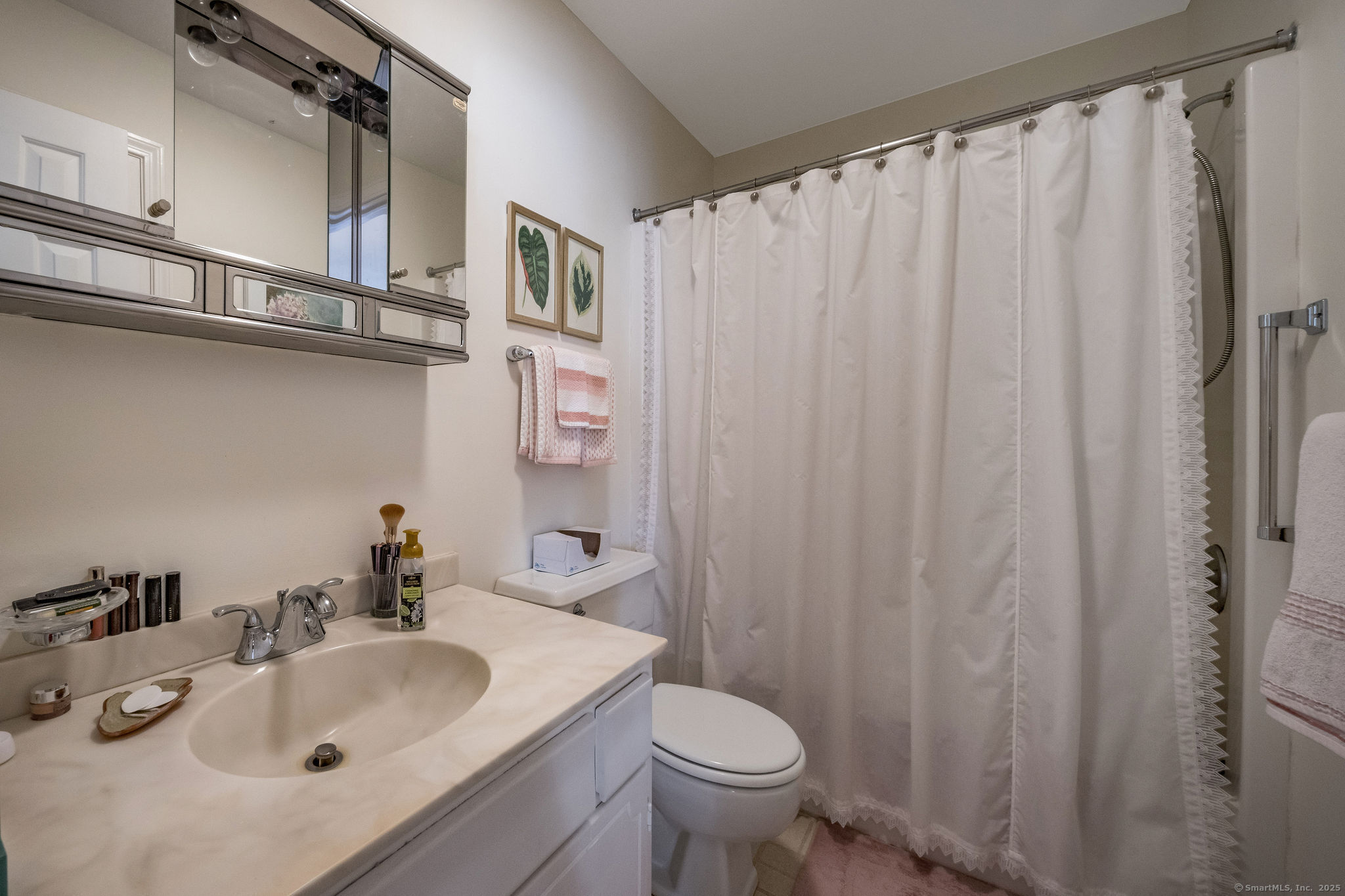 45 Wilshire Road, Unit 45 Madison, CT 06443 - Photo 15 of 25 a bathroom with a sink and a toilet