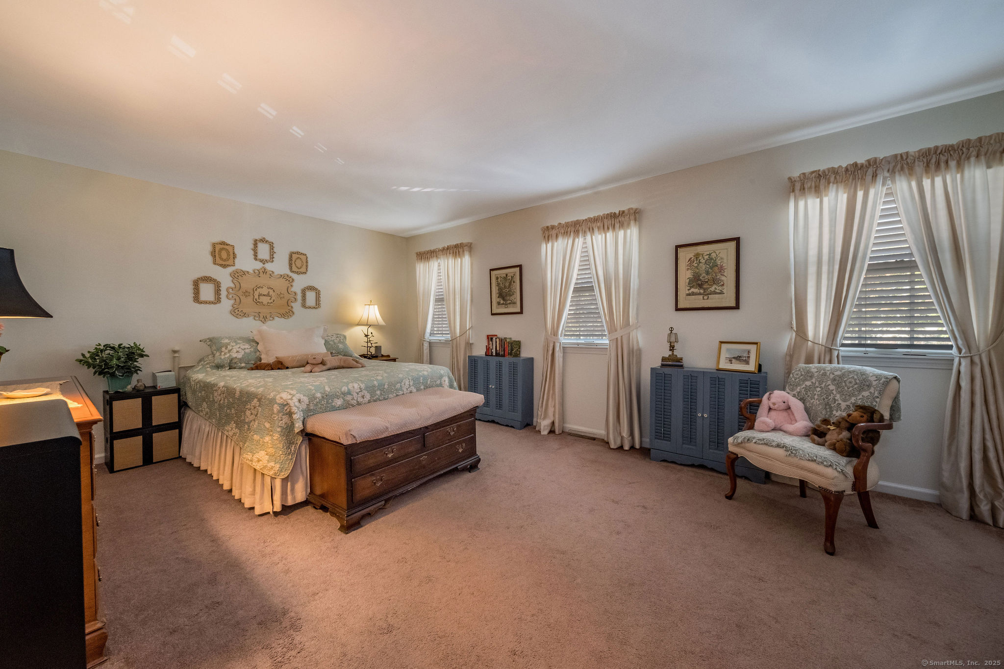 45 Wilshire Road, Unit 45 Madison, CT 06443 - Photo 17 of 25 a spacious bedroom with a bed and a couch
