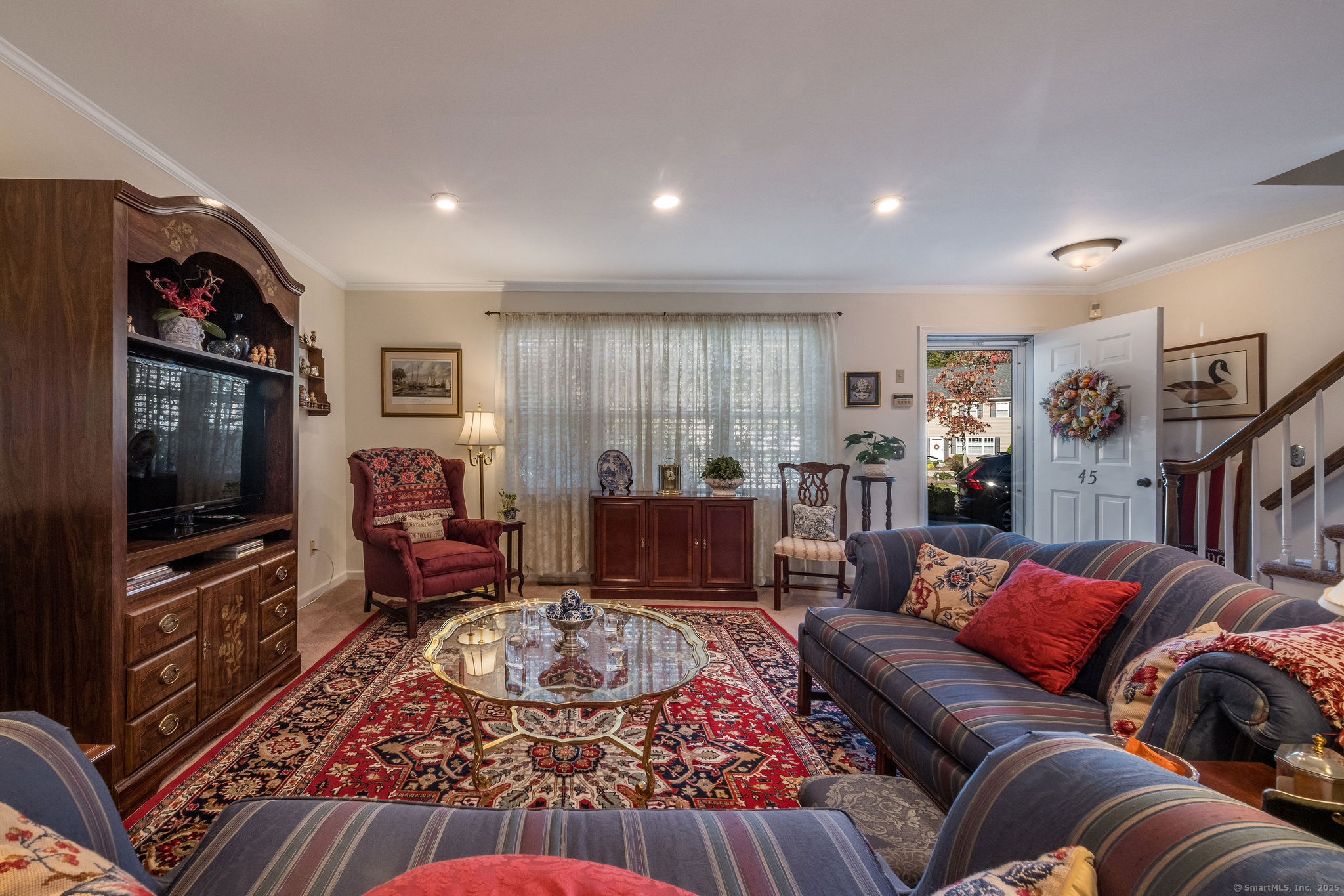 45 Wilshire Road, Unit 45 Madison, CT 06443 - Photo 2 of 25 a living room with furniture and a flat screen tv