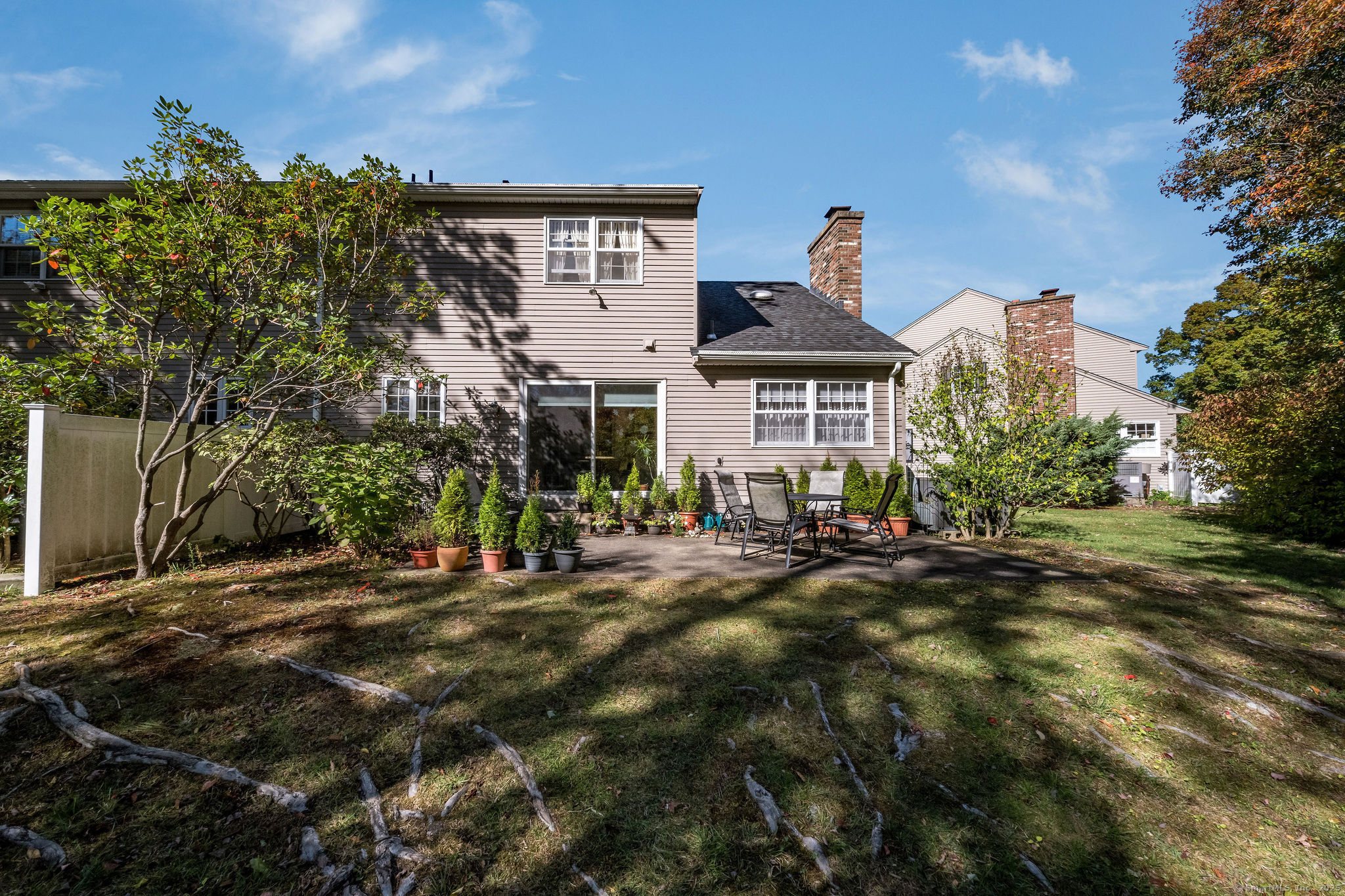 45 Wilshire Road, Unit 45 Madison, CT 06443 - Photo 23 of 25 a front view of a house with a yard