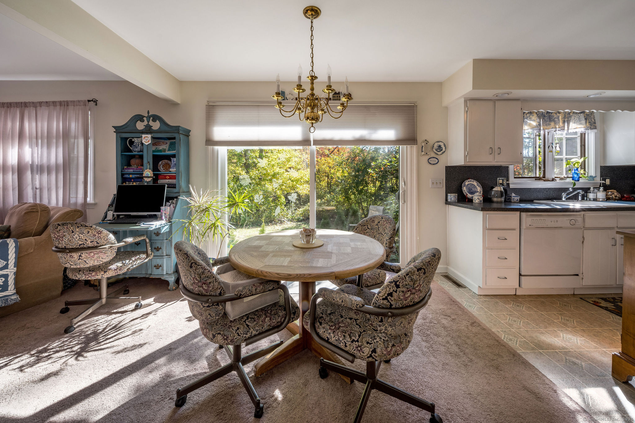 45 Wilshire Road, Unit 45 Madison, CT 06443 - Photo 8 of 25 a view of a dining room with furniture window and outside view