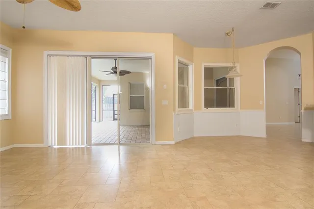 a view of an empty room with glass door
