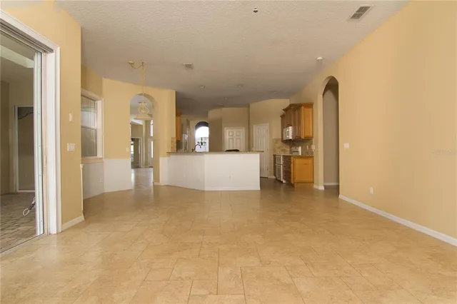 a view of a kitchen with a sink and cabinets