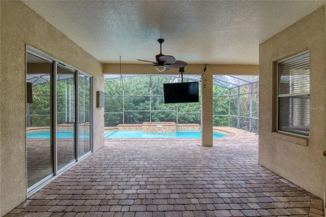 a view of empty room with floor to ceiling windows