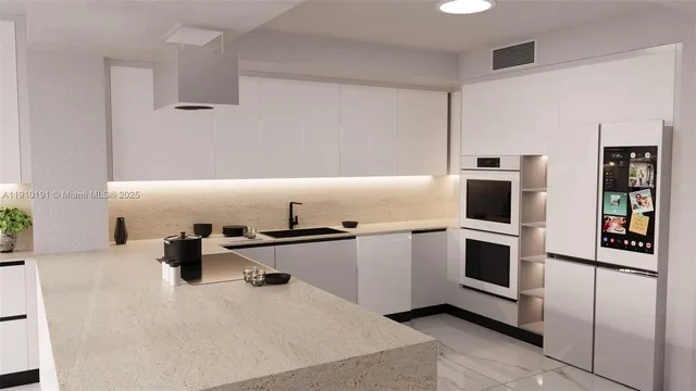 a kitchen with stainless steel appliances a stove sink and microwave