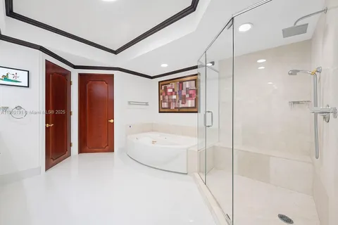 a spacious bathroom with a shower and a bathtub