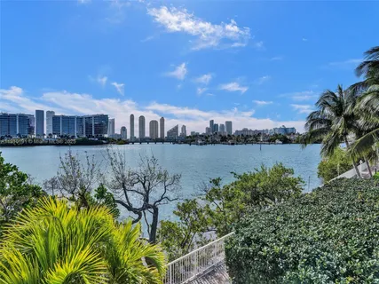 a view of a lake with a house in the background