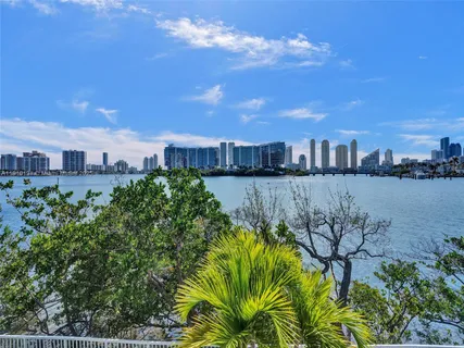 a view of a lake with houses in front of it