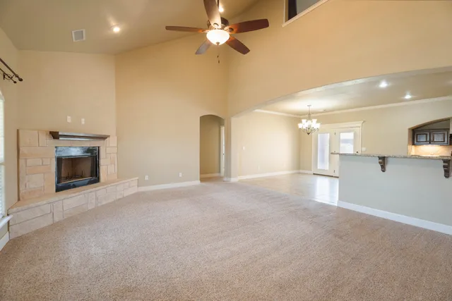 a view of an empty room with a fireplace
