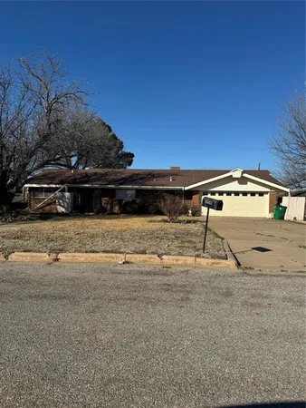 a view of a car park in front of house